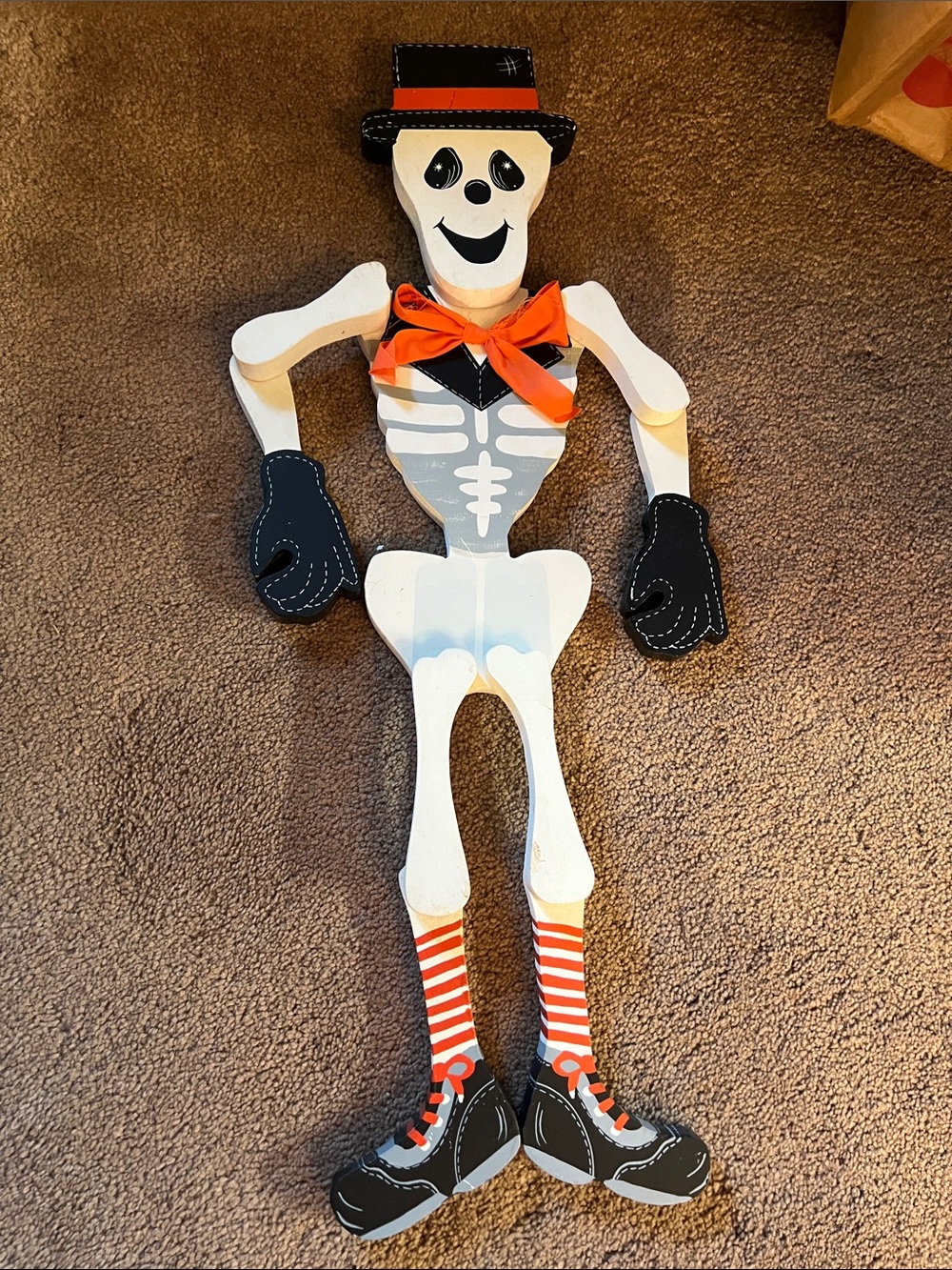 Skeleton Wood Decor with Orange Accents